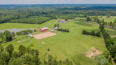 Expansive acreage with a versatile property featuring a spacious barn, fields, and nearby scenic views.