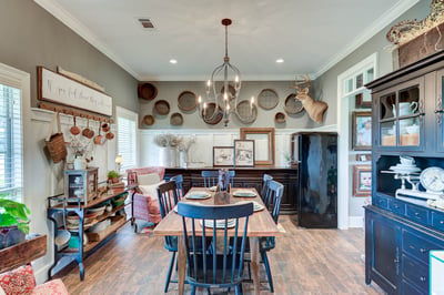 Bright and inviting dining area showcasing unique decor, ample seating, and a blend of rustic elements.