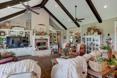 Spacious living area featuring vaulted ceilings, custom built-ins, and abundant natural light, perfect for gatherings.