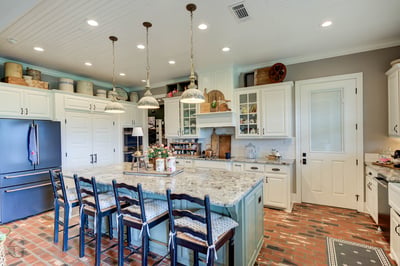 Spacious gourmet kitchen featuring modern appliances, ample storage, and a large central island for entertaining.