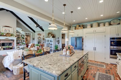 Spacious kitchen featuring a large island, abundant storage, and a cozy, inviting atmosphere for gatherings.