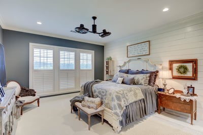 Spacious bedroom featuring ample natural light, modern amenities, and a cozy, inviting atmosphere.