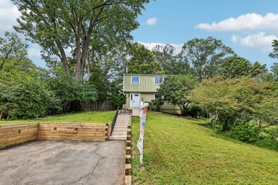Discover this unique home nestled on a spacious lot, ideal for outdoor activities and gardening.