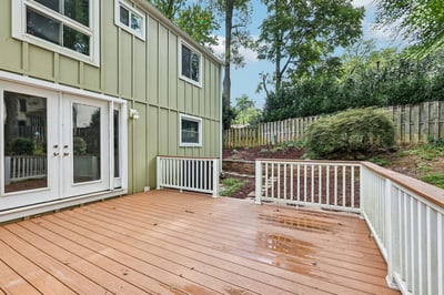 Spacious deck overlooking a lush yard, perfect for outdoor gatherings and creating lasting memories.