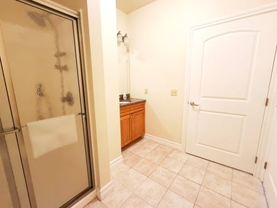 Full Bath w/ Single Sink Vanity & Entrance to Hall