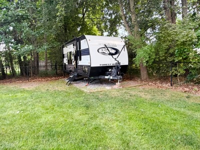 One of two gravel pads for storing equipment, a boat, or a camper.