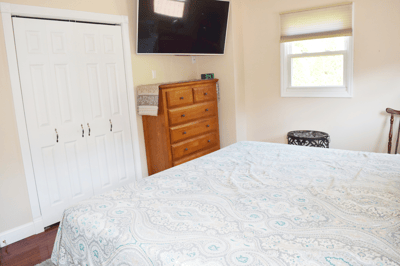 2 Double Door Closets; Wall-mount TV bracket included (TV excluded)