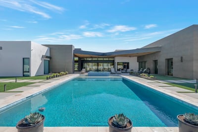 Stunning pool area with modern design, spacious patio, and desert landscaping. This Paradise Valley outdoor space is perfect for relaxing, entertaining, and enjoying resort-style living.