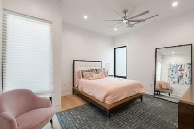Bright guest bedroom with modern finishes, soft lighting, and comfortable layout. This Paradise Valley home offers welcoming secondary spaces.