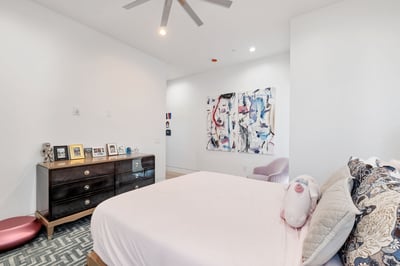 Well-lit bedroom with neutral tones and modern finishes. This Paradise Valley home provides flexible space for guests or family.
