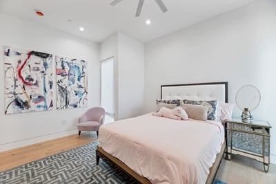Stylish bedroom featuring clean lines, updated flooring, and contemporary d cor. This Paradise Valley home blends comfort with design.