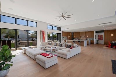 Inviting front living space filled with natural light and open flow to the kitchen. This Paradise Valley home highlights clean lines and contemporary style.