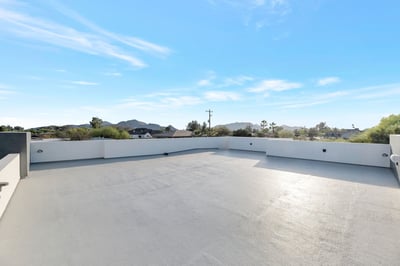 Expansive rooftop deck with scenic views and open space for entertaining. This Paradise Valley home delivers elevated outdoor living and privacy.