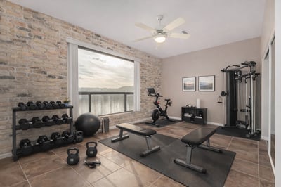 Versatile bedroom featuring a built-in Murphy bed with integrated shelving, maximizing functionality and storage. Ideal as a guest room, office, or multipurpose living space within this Fountain Hills home.