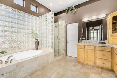 Elegant primary bath featuring a walk-in shower, soaking tub, generous vanity space, and quality finishes throughout. Designed to provide a resort-style experience at home.