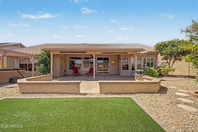 A large covered patio, artificial turf, and attractive landscaping make this backyard ideal for entertaining and everyday enjoyment. The spacious layout offers versatility while maintaining easy-care outdoor living.