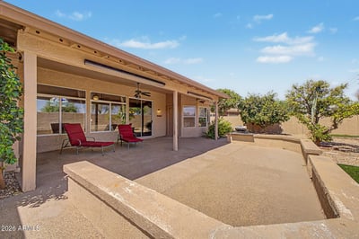This spacious covered patio serves as an extension of the home's living space, offering ample room for gatherings, outdoor seating, and relaxation. Easy access to the backyard and interior living areas enhances everyday enjoyment.