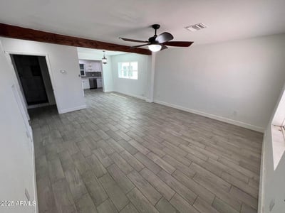 Wide-open living spaces, contemporary tile flooring, and modern finishes create a comfortable environment for entertaining and everyday life. The open layout enhances both functionality and visual appeal.