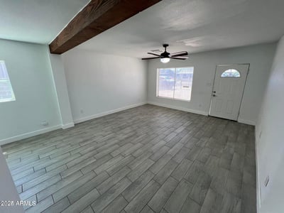 Bright and airy, this living room offers abundant natural light, updated finishes, and a spacious layout. It's an ideal gathering place that connects seamlessly with the rest of the home.