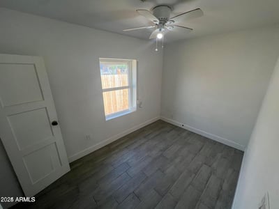 Fresh finishes, modern flooring, and natural light make this bedroom an attractive and versatile living space. Ideal for guests, family members, or creative workspace needs.