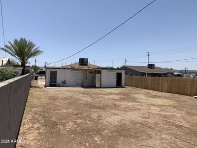 The expansive fenced backyard offers abundant space for entertaining, landscaping projects, outdoor activities, or future enhancements. This versatile outdoor area adds valuable living space to the property.