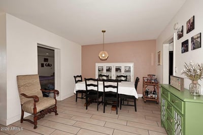 This welcoming dining space offers excellent flow between living areas, making it ideal for entertaining and daily use. Tile flooring and generous dimensions provide both style and functionality.