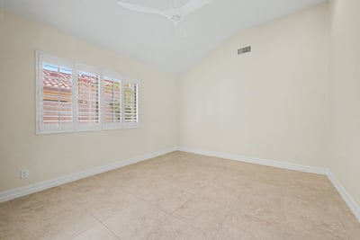 Bright flex space with vaulted ceilings and plantation shutters makes an ideal office, library, exercise room, or additional sitting area to fit your lifestyle.