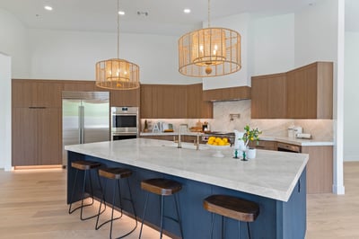 Stylish kitchen featuring an oversized island with seating, premium appliances, custom cabinetry, and elegant finishes. The open-concept layout makes hosting family and friends effortless.