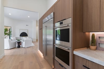 High-end custom cabinetry surrounding built-in premium appliances provides exceptional storage and a sleek modern aesthetic. Every detail reflects the quality craftsmanship found throughout this Scottsdale home.