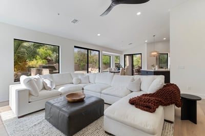 Open great room seamlessly connecting the kitchen, dining area, and outdoor living spaces. Bright natural light and contemporary finishes create a welcoming atmosphere throughout this Scottsdale home.