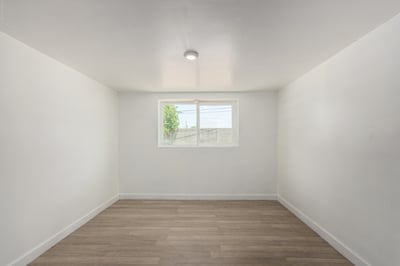 Bright bonus room with updated flooring and flexible layout perfect for a game room, office, exercise room, creative studio, or additional family living space in Mesa.
