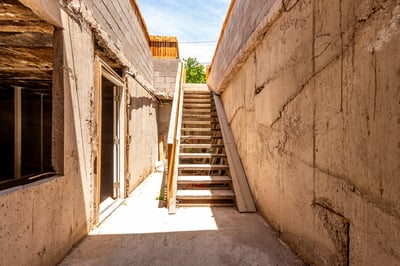 Exterior stair access leads directly to the expansive basement, providing convenient entry for storage, projects, or future use. A unique and practical feature rarely found in Mesa homes.