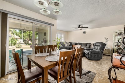 Dining area with direct access to the covered patio, creating effortless indoor-outdoor living while connecting seamlessly to the spacious living room.