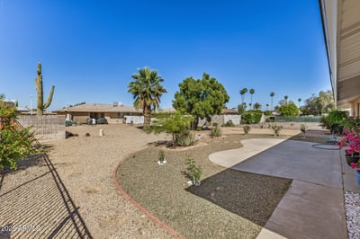 Enjoy a generous backyard with mature landscaping, covered patio space, and easy-care desert design. This Sun City home offers plenty of room for entertaining, relaxing, or creating your ideal outdoor retreat.