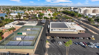 Aerial image showcases nearby tennis courts, recreation facilities, and surrounding neighborhood amenities, adding convenience and outdoor enjoyment to this Sun City location.
