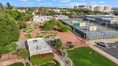 Aerial perspective features miniature golf, tennis courts, landscaped grounds, and nearby recreation amenities. Sun City offers an active outdoor lifestyle with exceptional community facilities.