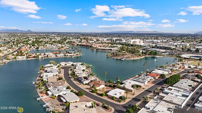 Panoramic aerial captures the beautiful lakes, waterfront homes, recreation facilities, and surrounding neighborhood. Discover the exceptional scenery and outdoor lifestyle available in Sun City.