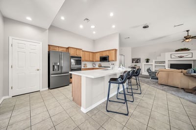 Bright breakfast nook with large windows and peaceful backyard views, offering the perfect setting for casual meals, coffee breaks, or enjoying natural light throughout the day.