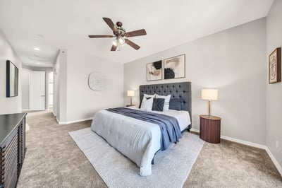 Spacious primary bedroom with neutral finishes, plush carpeting, and plenty of room for additional furniture. This inviting retreat connects seamlessly to the ensuite bathroom and walk-in closet.