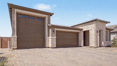 Oversized RV garage and attached 2-car garage provide incredible storage, convenience, and flexibility. Modern stone accents and premium finishes complete this impressive exterior.