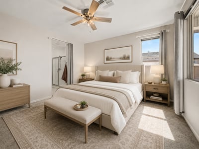 Virtually Staged Comfortable primary suite featuring plush carpeting, large windows, ceiling fan, and private access to the ensuite bathroom. A relaxing retreat designed for rest and everyday comfort.