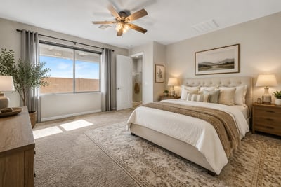 Virtually Staged Bright and inviting primary bedroom offering abundant natural light, plush carpeting, ceiling fan, and a spacious layout. Designed to provide comfort while complementing the home's modern aesthetic.