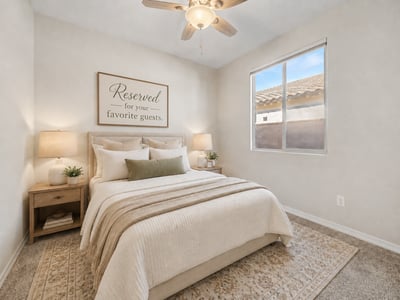 Virtually Staged Secondary bedroom with plush carpet, ceiling fan, and abundant natural light. The clean, neutral design provides a move-in-ready space suitable for guests or everyday living.