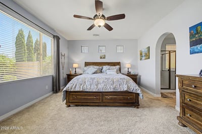 Enjoy comfort and privacy in the spacious owner's suite featuring large windows, soft carpeting, and generous room for relaxing. A tranquil retreat designed for everyday comfort.