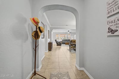 Elegant archways, spacious hallways, and attractive finishes create a warm and inviting entrance. The open design provides a welcoming introduction to the home's comfortable living spaces.