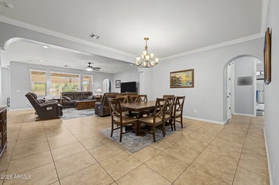 Designed for hosting family and friends, this spacious dining room offers elegant lighting, ample seating space, and seamless access to the great room for effortless entertaining.