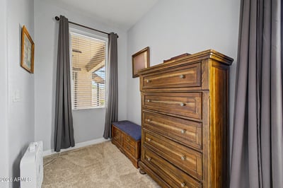 Filled with natural light, this comfortable secondary bedroom offers plush carpeting and flexible space for guests, family, or a private office. Its neutral palette makes it easy to personalize while enhancing the home's move-in-ready appeal.