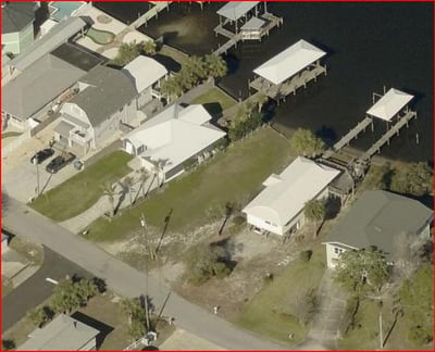 Spacious waterfront property featuring ample outdoor space your own boat dock. Perfect for boating enthusiasts!