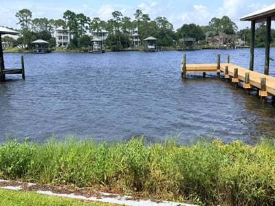Waterfront property featuring private dock access, offering stunning views and opportunities for outdoor activities.