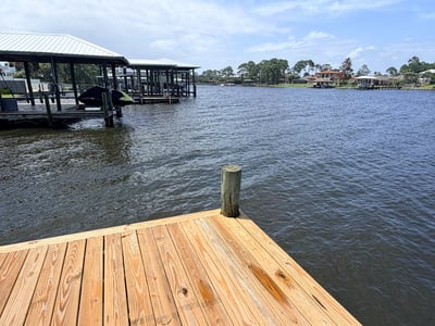 Waterfront property featuring a spacious dock, perfect for boating and enjoying scenic views.